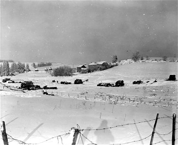 SC 329971 - Six inches of snow blanketed this American field artillery position in Belgian field near Bastogne. It fell within a 24 hour period. 5 January, 1945.