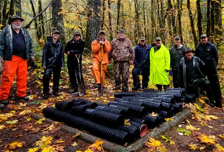 20221105-Volunteers pose near empty gallon planters near the wild turkey habitat improvement project area near the middle Wind River at Gifford Pinchot National Forest. Photo credit: The National Wild Turkey Federation WA Chapter