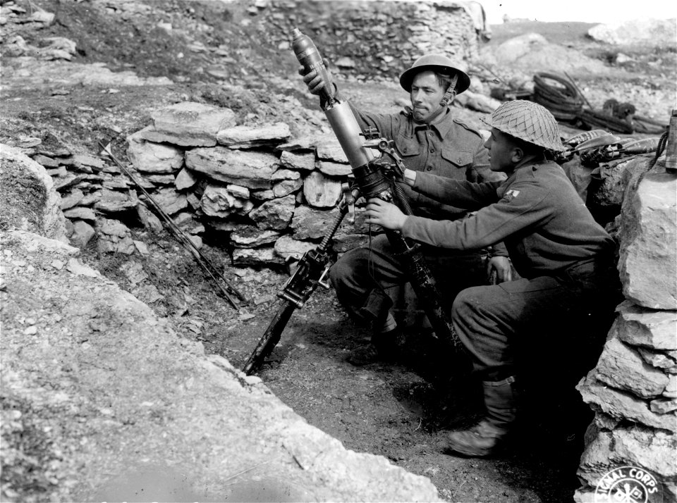 SC 336795 - Mortar platoon, 2nd Bn., 3rd Polish Div., firing a British 3 in. mortar. Mt. Croce, Cerro area, Italy.