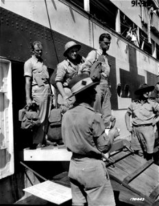 SC 170443 - American casualties from the Battle of Milne Bay are shown leaving the Australian Red Cross ship at Newstead Wharf, Brisbane. 14 September, 1942. photo