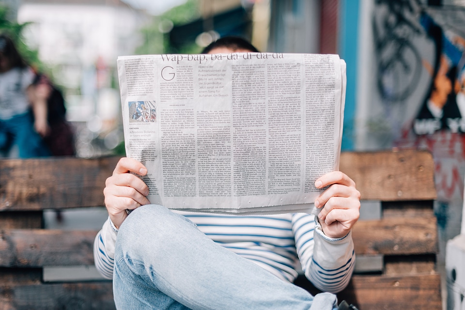 Man Reading Newspaper