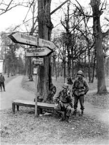 SC 337211 - Two men of 90th Division, 3rd U.S. Army, test communications during a lull in the advance, near Wilhelmsbad, Germany. photo