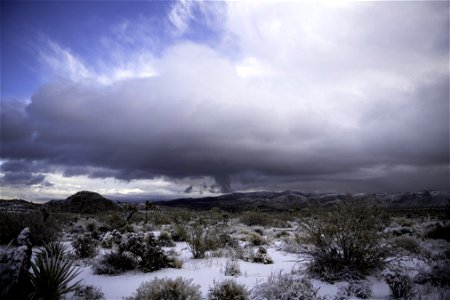 Snow over a desert landscape photo