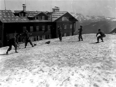 SC 337112 - Infantrymen of 319th Regiment, 80th Infantry Division, 3rd U.S. Army, make a snow ball fight on the top of Mt. Feurkoge a mile above Ebensee, Austria. photo