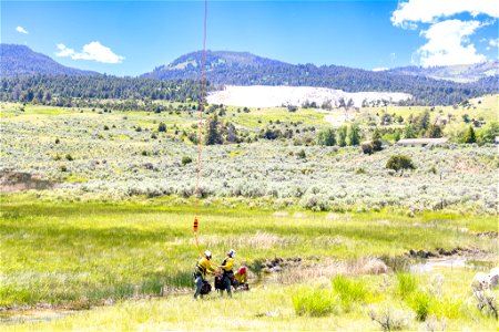 Yellowstone Helitack short-haul training: crew landing at the scene photo