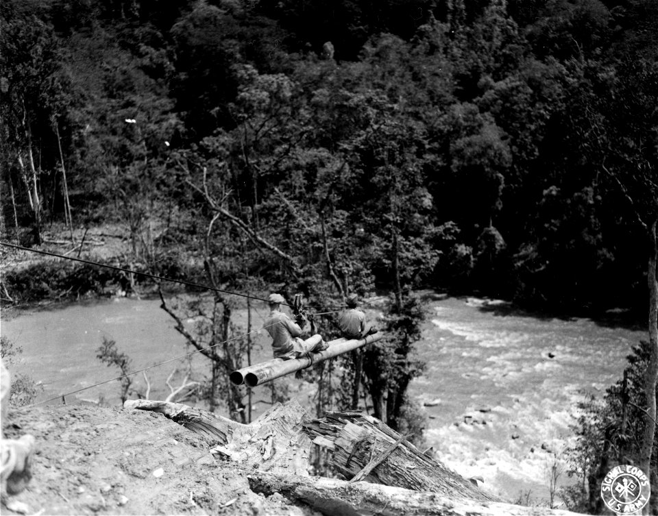 SC 374713 - During construction of 6" pipeline to China, due to lack of transportation facilities a 1000 ft. cable was strung 400 ft. over the the Loglai river near Loglai, Burma, to carry pipe, fittings and men to the opposite bank of the river.
