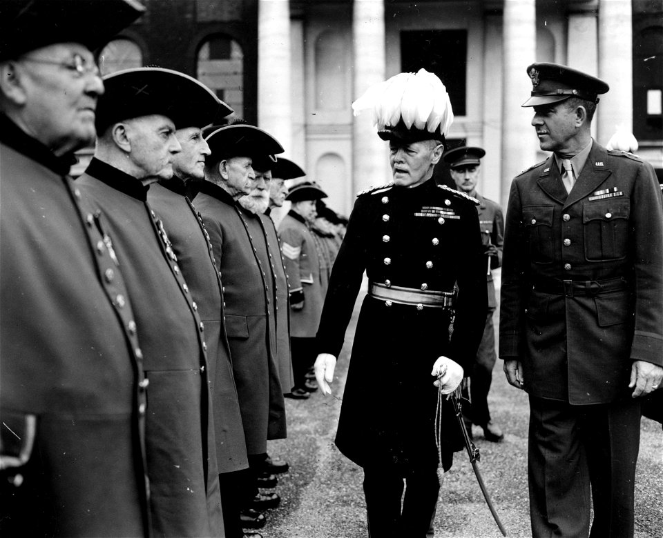 SC 329892 - Lt. Gen. Jacob L. Devers inspects pensioners of the Royal Chelsea Hospital who are lined up for church parade.