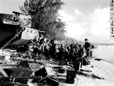Tractors and tanks landing the first day. Wounded being evacuated and men digging in for the first night. Saipan. 15 June, 1944.