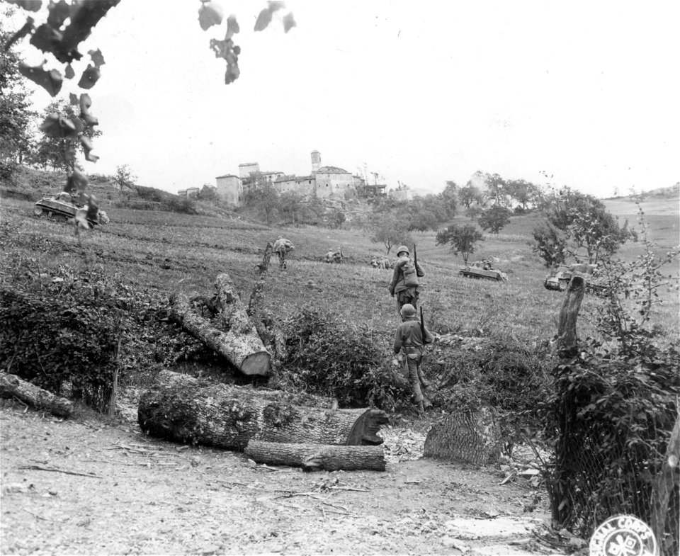 SC 270587 - Infantrymen of the 11th Armored Inf. Bn., moving toward the village of Bambiano a few minutes after it was occupied by leading units of the 11th Armored Inf. Bn. photo