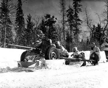 SC 364484 - AT section, 3rd Bn., 38th Inf. Regt., in place behind their 37mm anti-tank gun, having emplaced the weapon ready for action in less than three minutes.
