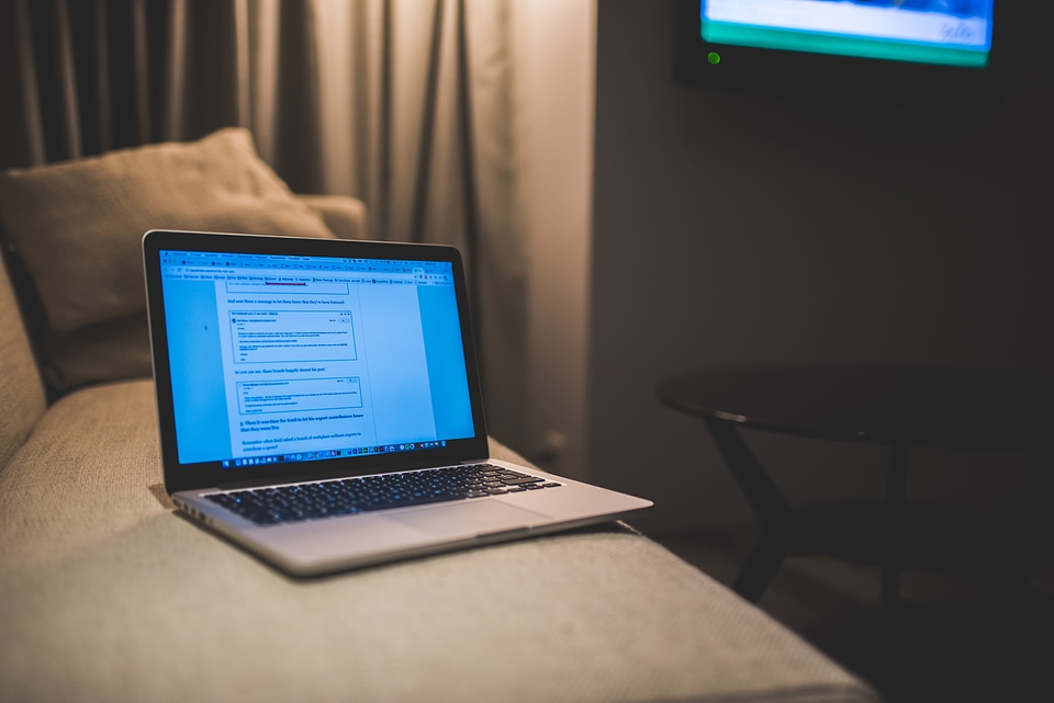 Laptop Open on Bed