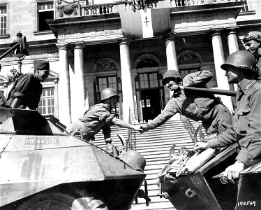 SC 195549 - The first meeting of American troops of General Patton's Third U.S. Army forces with French troops of General Patch's Seventh U.S. Army took place recently when their long reconnaissance arms met at Autun, France.