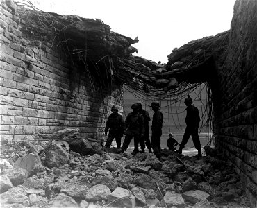 SC 335266 - Engineers of the 87th Division, Third U.S. Army, prepare to clear debris from a blown-up bridge so vehicles may pass through to be ferried across the Moselle River.