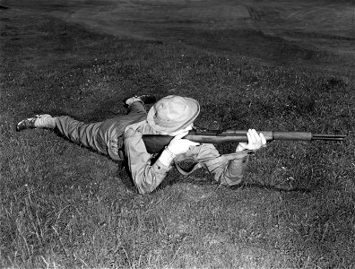 SC 364549 - Training picture to show correct rifle form while in prone position. Posed by T/5 Walter Barnett of Oklahoma City, Oklahoma. 7 July, 1943.