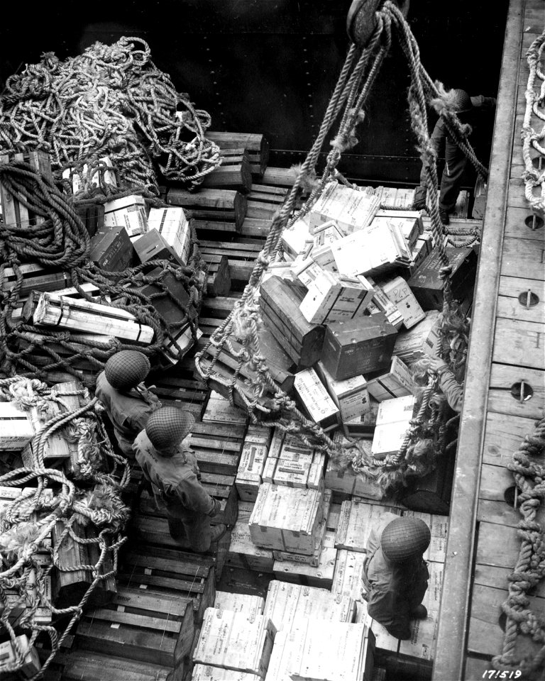 SC 171519 - From the shiphold a huge tonnage of ammunition is hoisted to be used for blasting the Japs from their island stronghold. Attu, Aleutians. 1943.