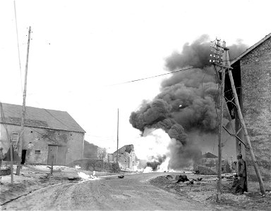 SC 199061-S - Flames and smoke billow from gas truck which accidentally caught fire in Bertring, France. 19 January, 1945.
