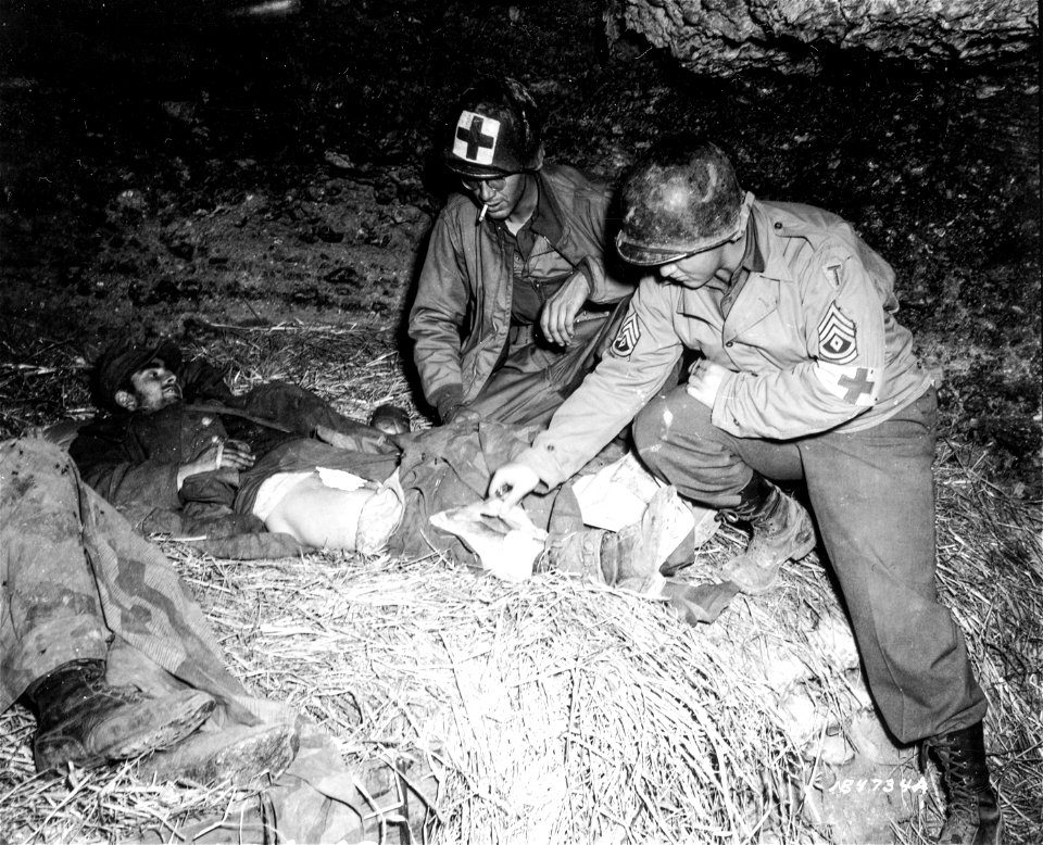SC 184734 - Wounded Germans are treated by medics.