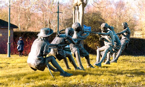 TUG OF WAR KINGS HILL WEST MALLING KENT  BY W STANLEY PROCTOR This 20 ft long bronze sculpture, installed in 2002, features six children – three boys and three girls – plus a dog, pulling the rope in a tug of war.