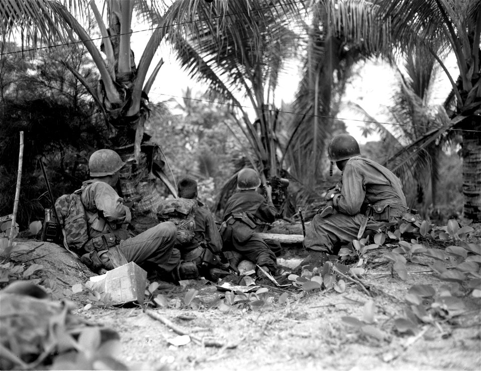 SC 364494 - Heavy machine gun crew set up quickly on the beach near Aitape, New Guinea.
