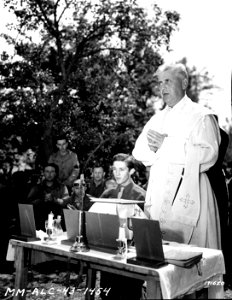 SC 171620 - Chaplain (Col.) M.S. Chatalgood, Galveston, Texas, saying Mass on Easter Sunday for Headquarters Company, 33rd Signal Battalion. Tunisia, North Africa. 25 March, 1943.
