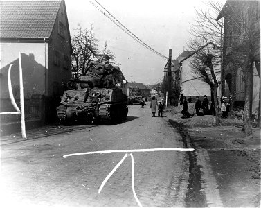 SC 335278 - Tanks of the 9th Armored Division, 1st U.S. Army, move through Leutesdorf, Germany, on the east bank of the Rhine. With very little opposition. photo