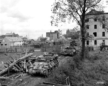 SC 195733 - German observation posts in Aachen, Germany, are targets for these M10s and their three-inch guns of "A" Co., 634th TD Bn. 14 October, 1944.