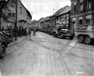 SC 335253 - Still another small German town falls to the infantrymen of the 9th Armored Division, U.S. First Army, as they drive through Kleinbullesheim, Germany, in the march to the Rhine River. photo