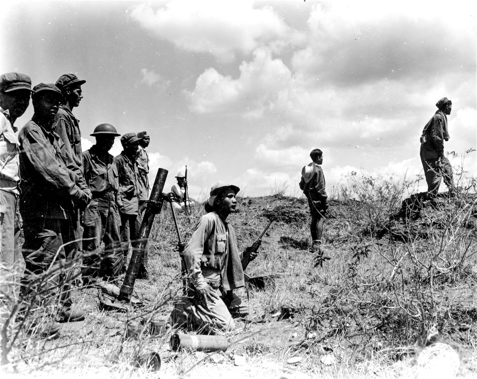 SC 364516 - Members of the mortar squad of K Co., 3rd Bn., 15th Regt., Philippine Army, watching a mortar shell fall on the enemy lines.