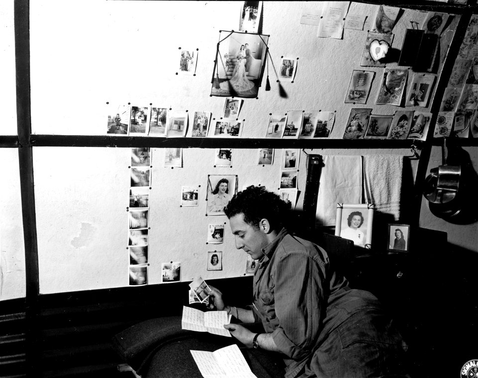 SC 196139-S - Pfc. Dominick Cianci claims to lead the island with his 55 pin-ups of his wife. Reykjavik, Iceland. 26 September, 1944.
