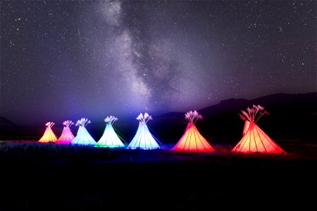 Yellowstone Revealed: illuminated teepees and Milky Way at North Entrance in Gardiner, Montana (2) photo