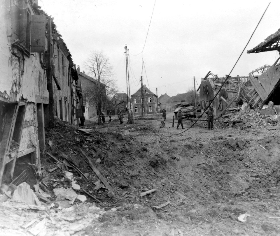 SC 334979 - Retreating Germans blasted this crater on far side of Kelz, Germany, to impede advance of 1st U.S. Army troops.