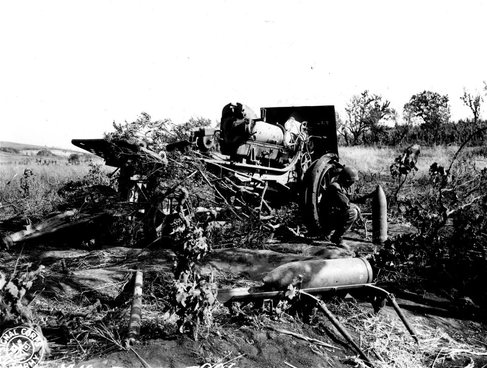 SC 329829 - General views of knocked-out German 220mm howitzer which delivered the "Anzio Express" to American troops in early days of beachhead. Note size of shells they shoot. 28 May, 1944.