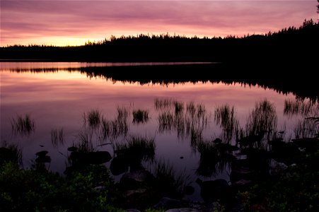Rosy sunrise on Waldo Lake, Oregon photo