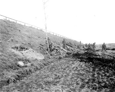 SC 270651 - Infantrymen dug in along bank of autobahn, holding the point important to the troops.
