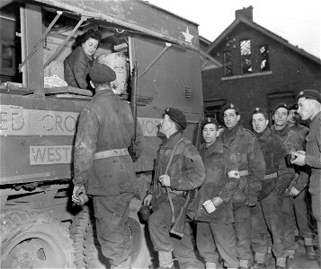 SC 329793 - Chu Chu Swanson ARC, 303 Grove St., Fort Wayne, Indiana, serving coffee and donuts to the "Green Devils" (a name given to the Commandos by the Germans for their green berets).