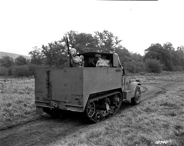 SC 151740 - The rear of a half-track carrier is shown mounting a 75mm gun somewhere in England.