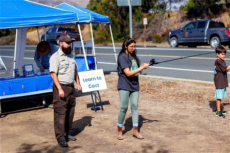 Attendees learn to cast with refuge staff