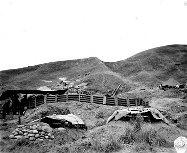 SC 364519 - #4 gun, 105 howitzer, of the 64th F.A. Bn., 25th Inf. Div., showing how it is dug in on the road to Balete Pass, Luzon, P.I. photo