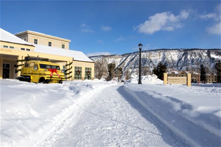 Xanterra Bombardier snowcoach decorated for the holidays in front of the Mammoth Hot Springs Hotel (3) photo