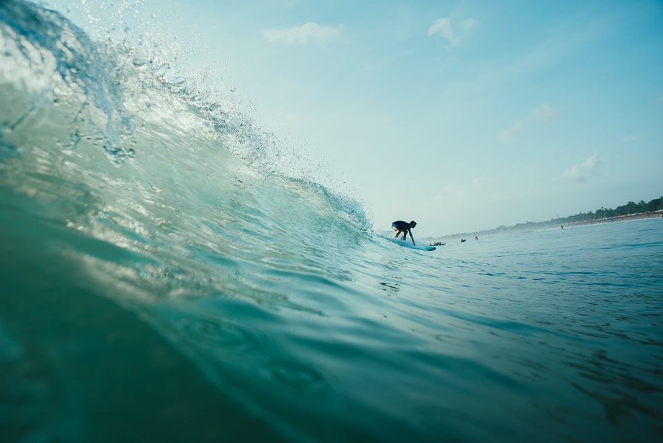 Surfer Riding the Wave