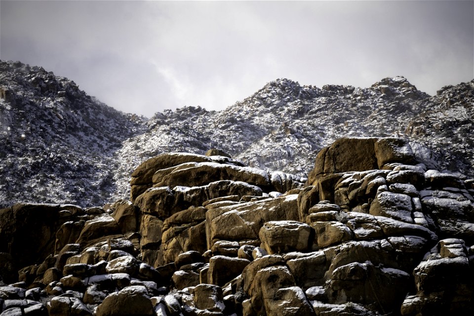Dusting of snow on monzogranite boulders
