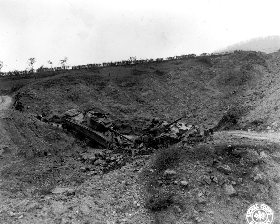 Two tanks form a V where they have both slipped off road. Tole area, Italy.
