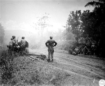 SC 364531 - 57mm and 75mm guns firing at Jap positions near [illegible], Luzon, P.I. photo