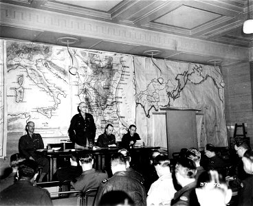 SC 374770 - Correspondents get briefed on what and what not to write at a Map Orientation Instruction office somewhere in England. 6 June, 1944. photo
