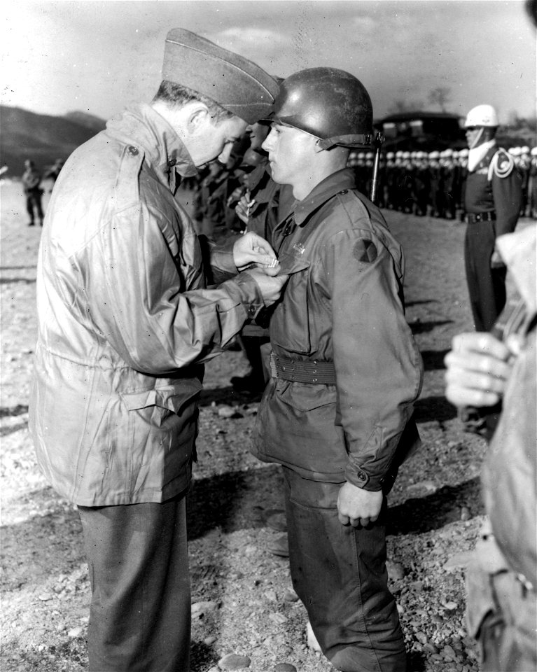 SC 364061 - (L-R) Sec of Army Frank Pace, Jr., pins the Silver Star medal on Pfc. George Rich, Robinson, Ill., HQ Co., 2nd Bn., 17th Inf. Regt., 7th U.S. Inf. Div., at ceremonies held at the Honchon Airstrip.