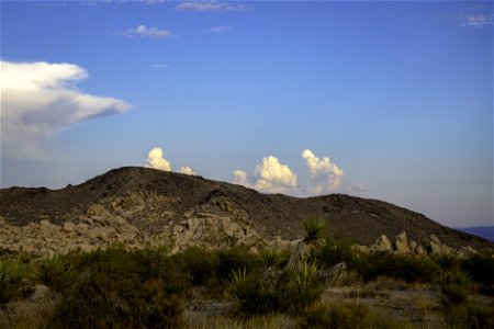 Clouds over desert mountains photo