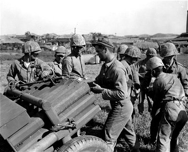 SC 349020 - Multiple 4.5 rocket launcher of the 1st Marine Division being loaded to fire on retreating North Korean forces east of Inchon. 17 September, 1950.