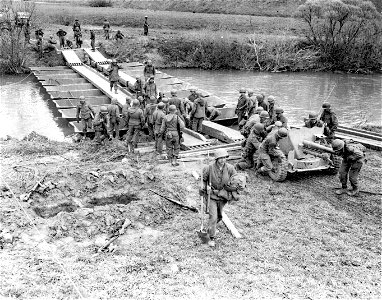 SC 335356 - It's only a little pontoon bridge, but Engrs. knew there was a war on when they labored for two days under all kinds of enemy fire to build it... photo