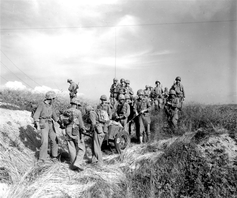 SC 348693 - Members of the 5th Marine Regt. move toward the Han River, in offensive launched against the North Korean enemy forces. 18 September, 1950.