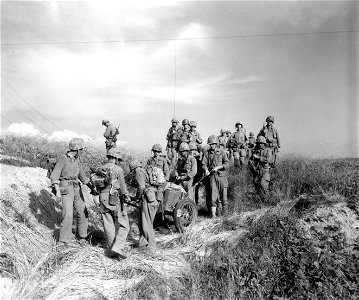 SC 348693 - Members of the 5th Marine Regt. move toward the Han River, in offensive launched against the North Korean enemy forces. 18 September, 1950. photo